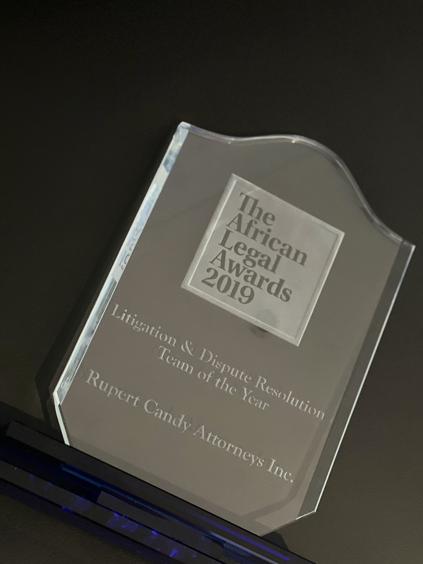 The African Legal Awards 2019 glass trophy, etched Litigation and Dispute Resolution Team of the Year, Rupert Candy Attorneys Inc.