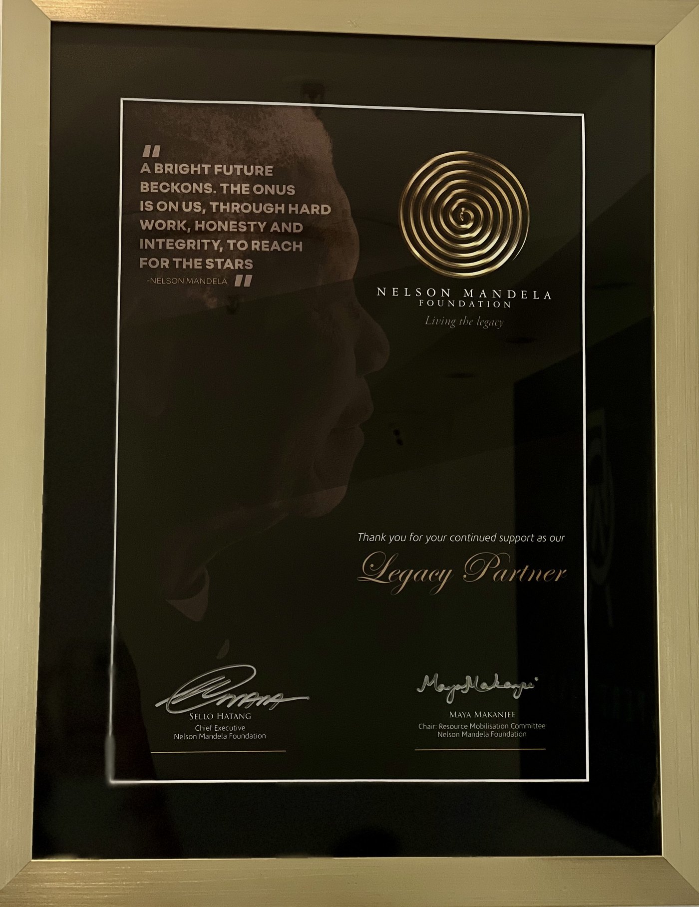 Nelson Mandela Foundation Legacy Partner certificate in a gold frame